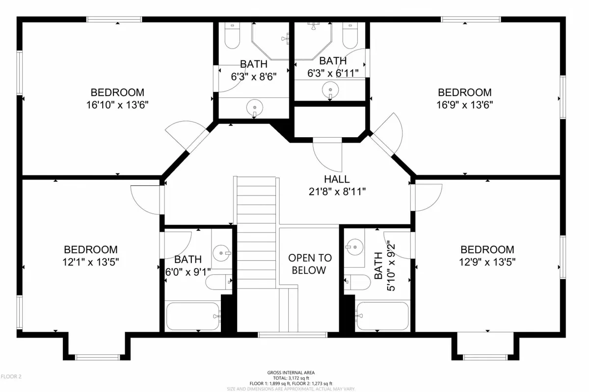 A bright interior hallway connects multiple bedrooms and bathrooms, as well as a staircase. The image features cozy beds, a serene bathroom, and a peaceful atmosphere—spaces where guests can unwind and feel at home.
